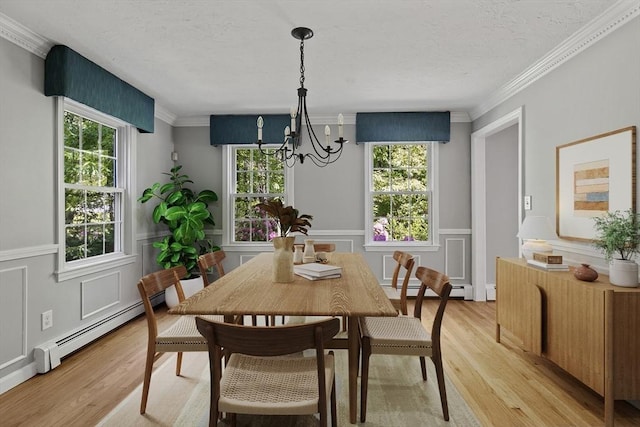 92 Clinton St, Hopkinton, MA 01748 - dining room with a chandelier, a baseboard radiator, light wood finished floors, a baseboard heating unit, and a textured ceiling