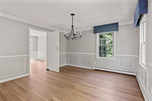 92 Clinton St, Hopkinton, MA 01748 - unfurnished dining area with a baseboard radiator, a chandelier, ornamental molding, light wood-style flooring, and a decorative wall