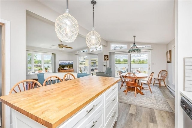 1 Shore Ave, Beverly, MA 01915 - dining room with lofted ceiling, light wood-type flooring, a baseboard radiator, and a ceiling fan
