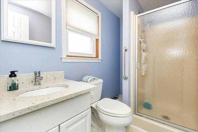 1 Shore Ave, Beverly, MA 01915 - bathroom featuring a stall shower, vanity, and toilet