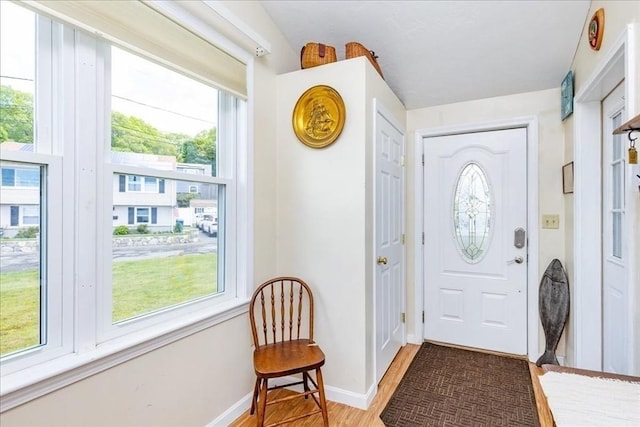 1 Shore Ave, Beverly, MA 01915 - entrance foyer featuring plenty of natural light, light wood-type flooring, and baseboards