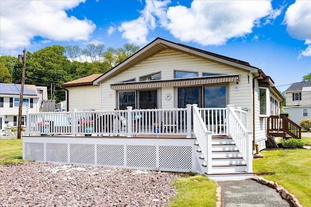 1 Shore Ave, Beverly, MA 01915 - view of front of house featuring a wooden deck and a front lawn