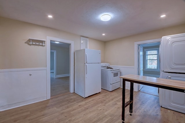 kitchen featuring wood counters, white appliances, light hardwood / wood-style floors, and washer / clothes dryer