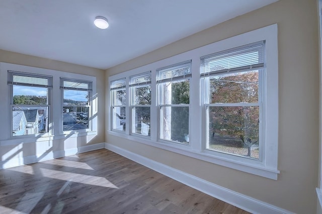 unfurnished sunroom featuring plenty of natural light