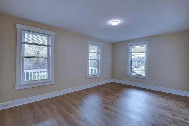 empty room with wood-type flooring