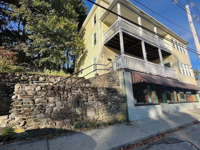 view of property exterior featuring a balcony