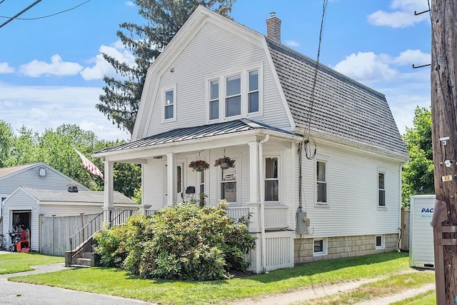 11 Draper Rd, Framingham, MA 01702 - dutch colonial featuring covered porch, a chimney, a standing seam roof, a metal roof, and a front yard