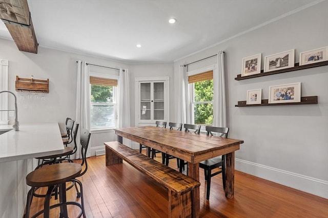 11 Draper Rd, Framingham, MA 01702 - dining room with plenty of natural light, hardwood / wood-style flooring, crown molding, and recessed lighting