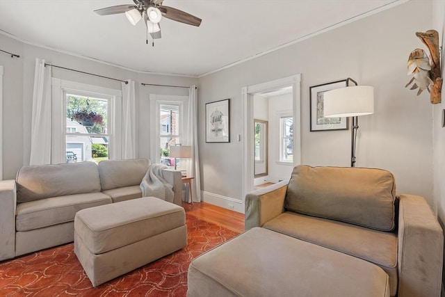 11 Draper Rd, Framingham, MA 01702 - living area featuring a ceiling fan, wood finished floors, and crown molding