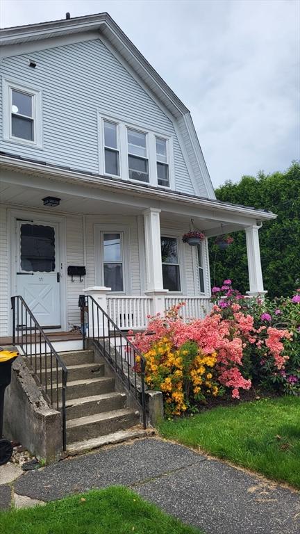 11 Draper Rd, Framingham, MA 01702 - colonial inspired home with covered porch and a gambrel roof