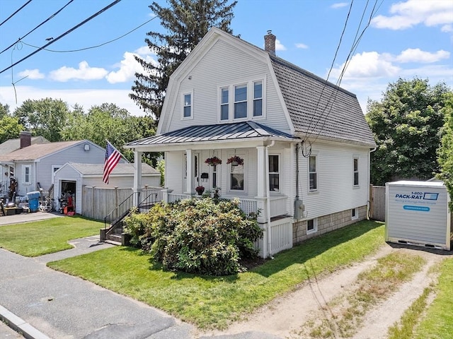 11 Draper Rd, Framingham, MA 01702 - dutch colonial featuring covered porch, a standing seam roof, a chimney, a metal roof, and driveway