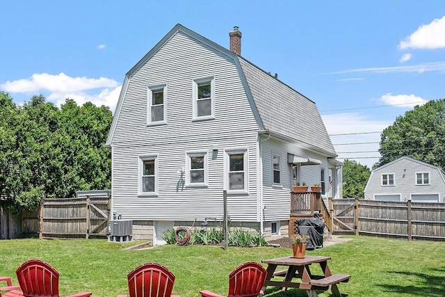 11 Draper Rd, Framingham, MA 01702 - rear view of house featuring a fenced backyard, a chimney, and a gambrel roof