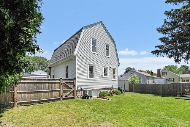 11 Draper Rd, Framingham, MA 01702 - rear view of property featuring a fenced backyard and a gambrel roof