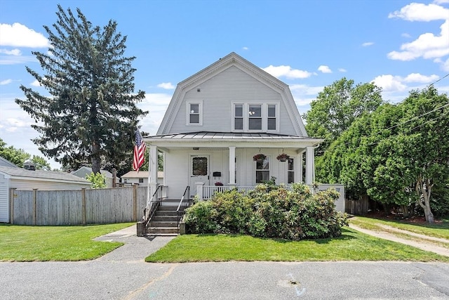 11 Draper Rd, Framingham, MA 01702 - colonial inspired home featuring a gambrel roof, covered porch, a standing seam roof, and a metal roof
