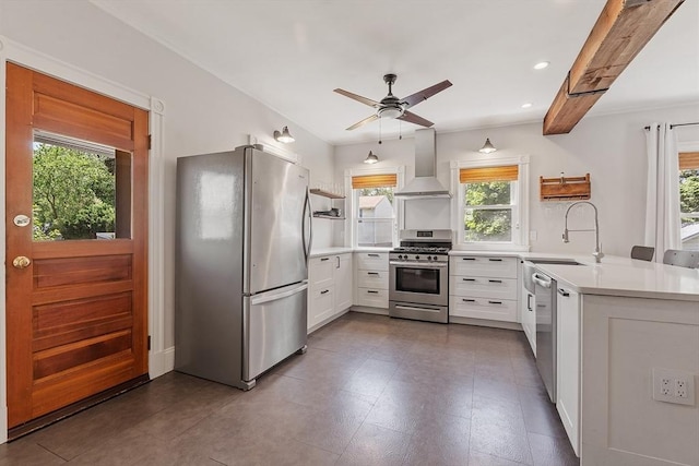 11 Draper Rd, Framingham, MA 01702 - kitchen featuring appliances with stainless steel finishes, wall chimney range hood, plenty of natural light, ceiling fan, and recessed lighting