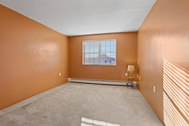 unfurnished room with a textured ceiling, light colored carpet, and baseboard heating