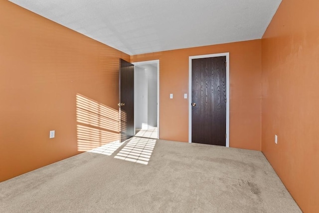 unfurnished room featuring carpet floors