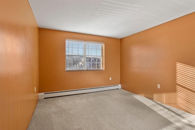 carpeted empty room with baseboard heating