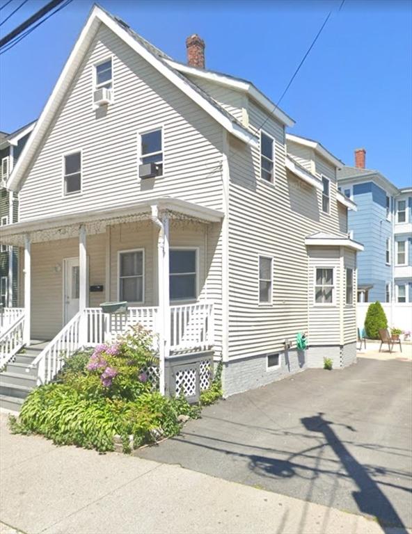 9 Cedar St, Lynn, MA 01905 - view of front facade featuring a chimney, a porch, and cooling unit