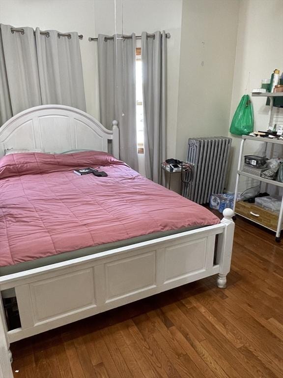 9 Cedar St, Lynn, MA 01905 - bedroom featuring radiator heating unit and wood finished floors