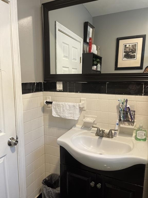 9 Cedar St, Lynn, MA 01905 - bathroom featuring vanity and tile walls