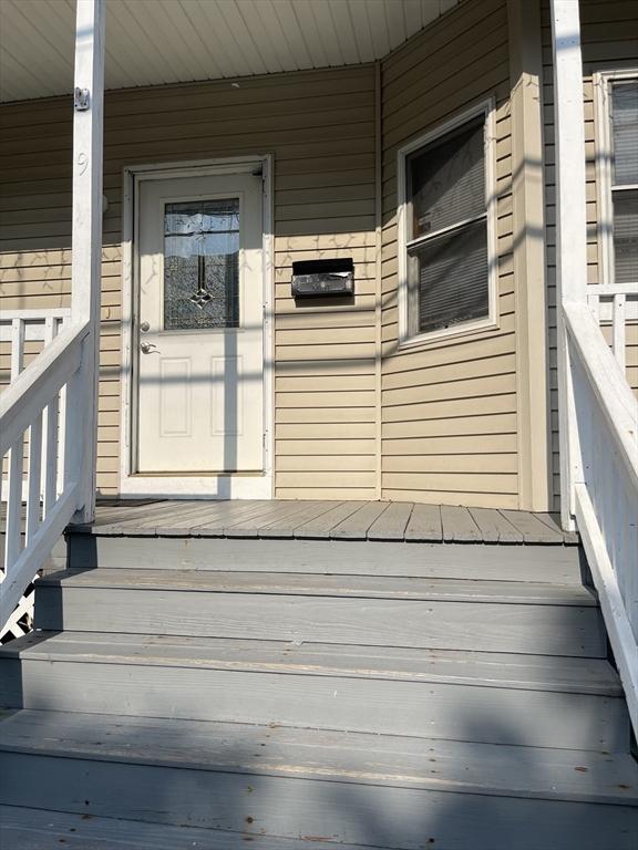 9 Cedar St, Lynn, MA 01905 - doorway to property with a porch
