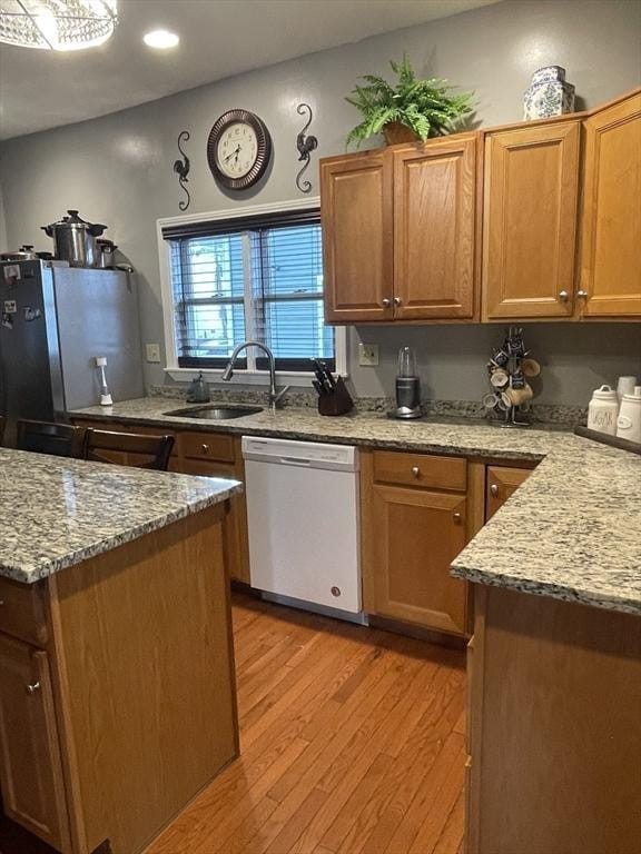 9 Cedar St, Lynn, MA 01905 - kitchen with white dishwasher, freestanding refrigerator, light wood-style flooring, light stone counters, and recessed lighting