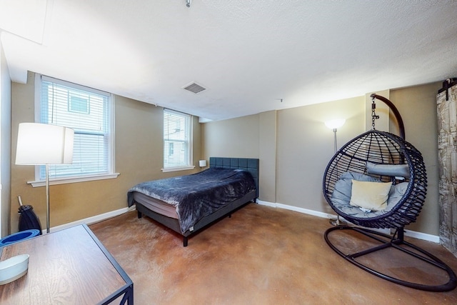 carpeted bedroom with a textured ceiling