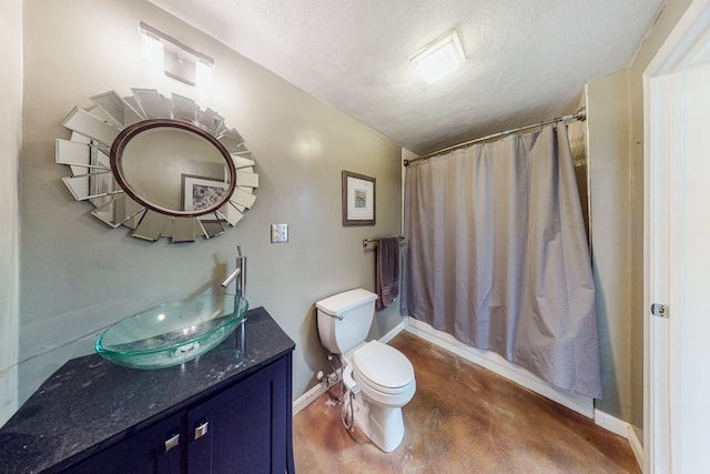 full bathroom with shower / bath combo with shower curtain, vanity, a textured ceiling, and toilet