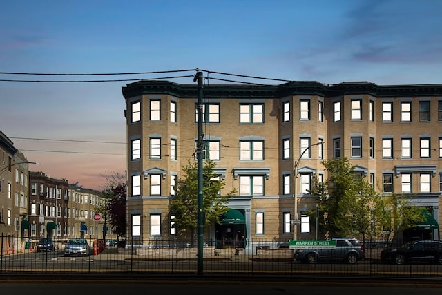 view of outdoor building at dusk