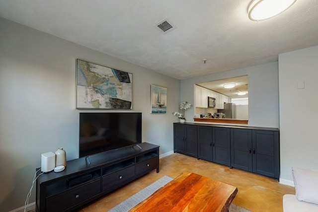 living room featuring a textured ceiling