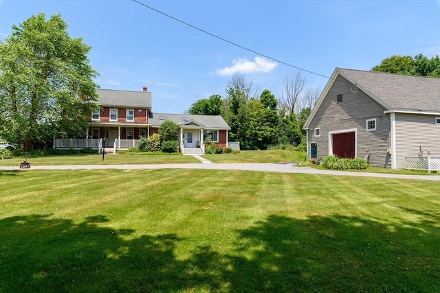 view of front of property with a front yard and covered porch