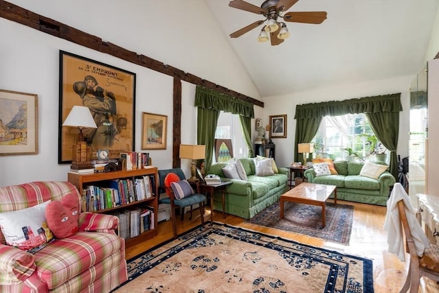 living area featuring ceiling fan, high vaulted ceiling, and hardwood / wood-style flooring