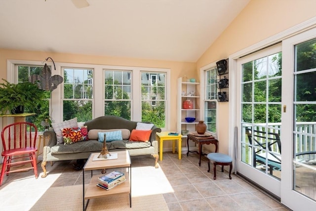 sunroom / solarium featuring vaulted ceiling