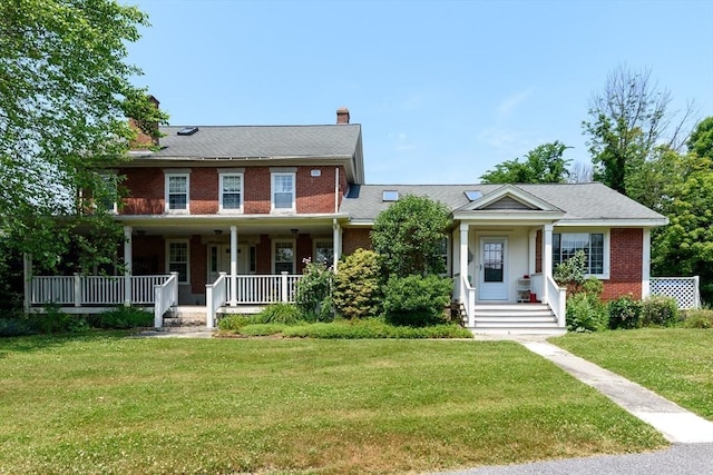 colonial-style house with a front lawn and a porch