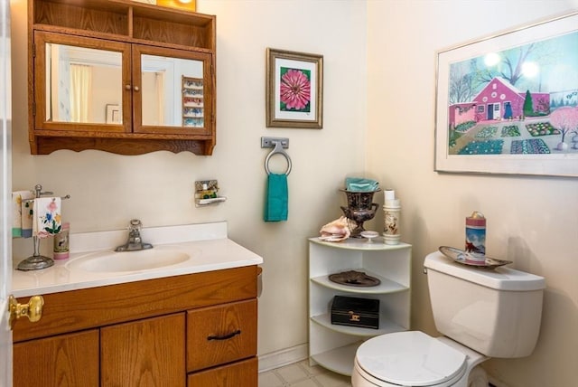 bathroom with toilet and vanity