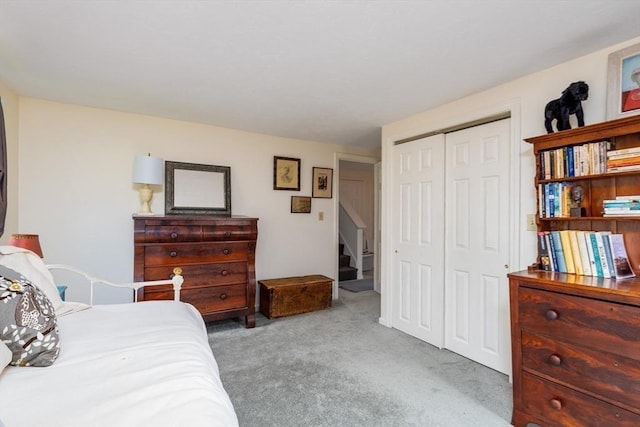 carpeted bedroom featuring a closet