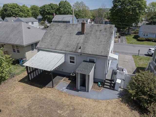 33 Altoona Rd, Dedham, MA 02026 - back of house featuring a gate, a chimney, central air condition unit, and roof with shingles