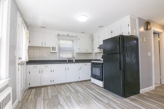 33 Altoona Rd, Dedham, MA 02026 - kitchen featuring freestanding refrigerator, range with gas stovetop, dark countertops, white cabinets, and a sink