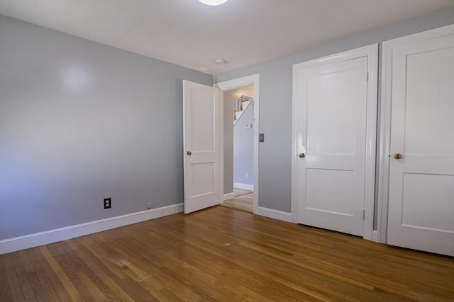 33 Altoona Rd, Dedham, MA 02026 - unfurnished bedroom with wood finished floors and baseboards