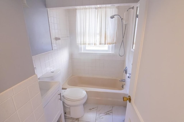 33 Altoona Rd, Dedham, MA 02026 - bathroom featuring toilet, tub / shower combination, tile walls, and marble look tiles