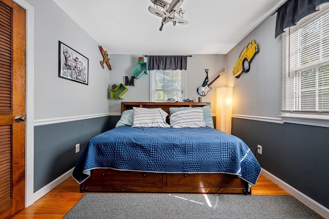 bedroom with hardwood / wood-style flooring