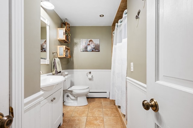 bathroom featuring vanity, a shower with shower curtain, a baseboard radiator, toilet, and tile patterned floors