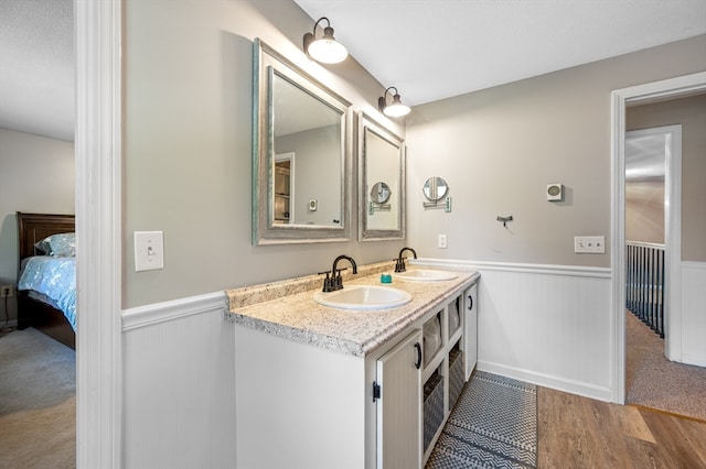 bathroom featuring hardwood / wood-style flooring and vanity