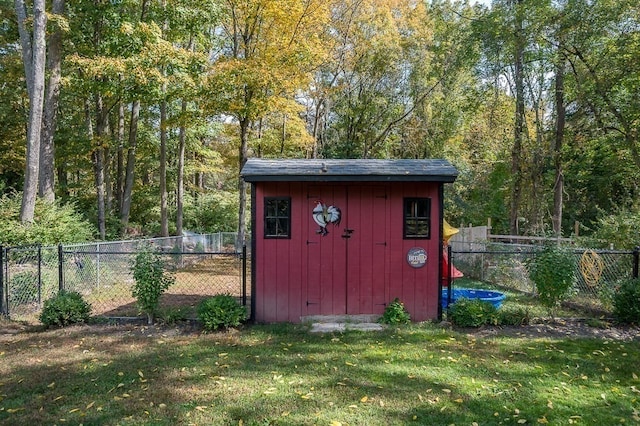 view of outbuilding with a lawn