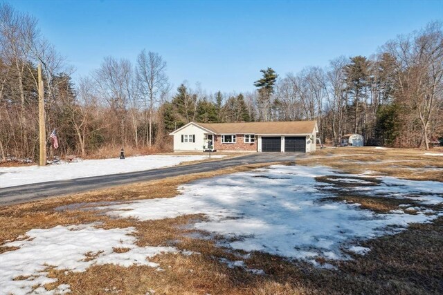 view of front of home with a garage and driveway