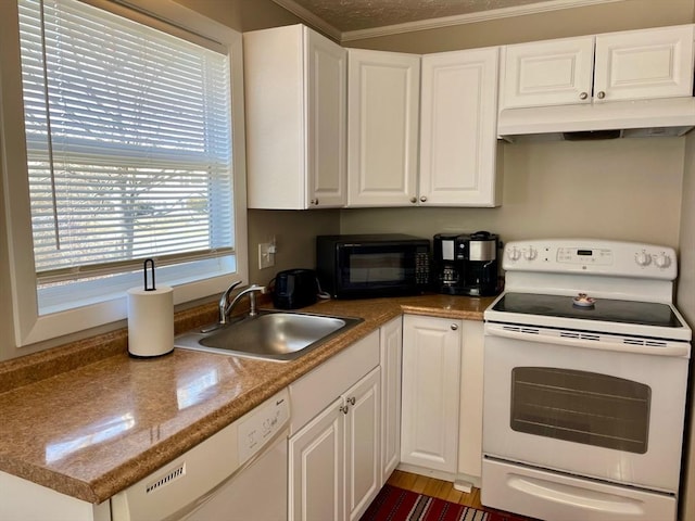 kitchen with white appliances, white cabinetry, a sink, and under cabinet range hood