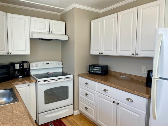 kitchen featuring white cabinets, under cabinet range hood, white appliances, and crown molding