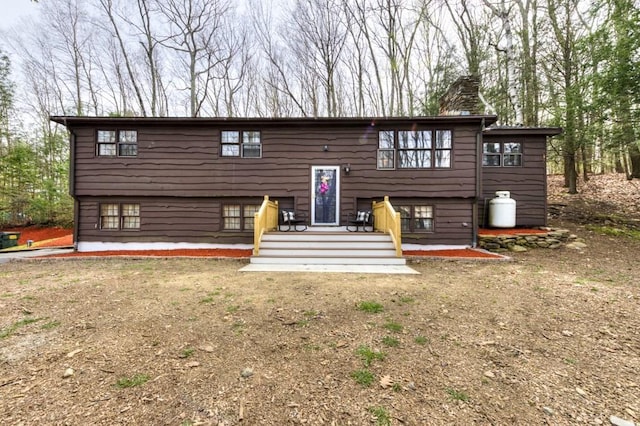 back of property featuring a chimney