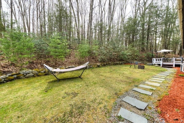 view of yard featuring a wooden deck
